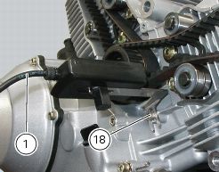 Workshop manual photo of acoustic sensor mounted engine case, facing a timing belt