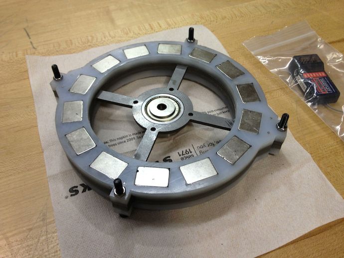 Two rotor plates with magnets facing "outwards" so that they press against the steel as the epoxy cures